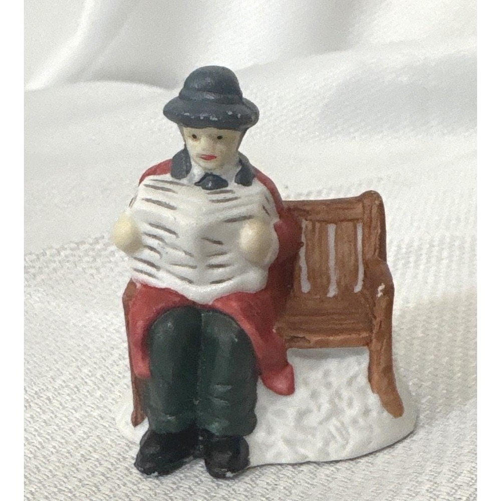 Vintage Christmas Village Figurine Man Reading Newspaper on Bench Red Coat 2.5"
